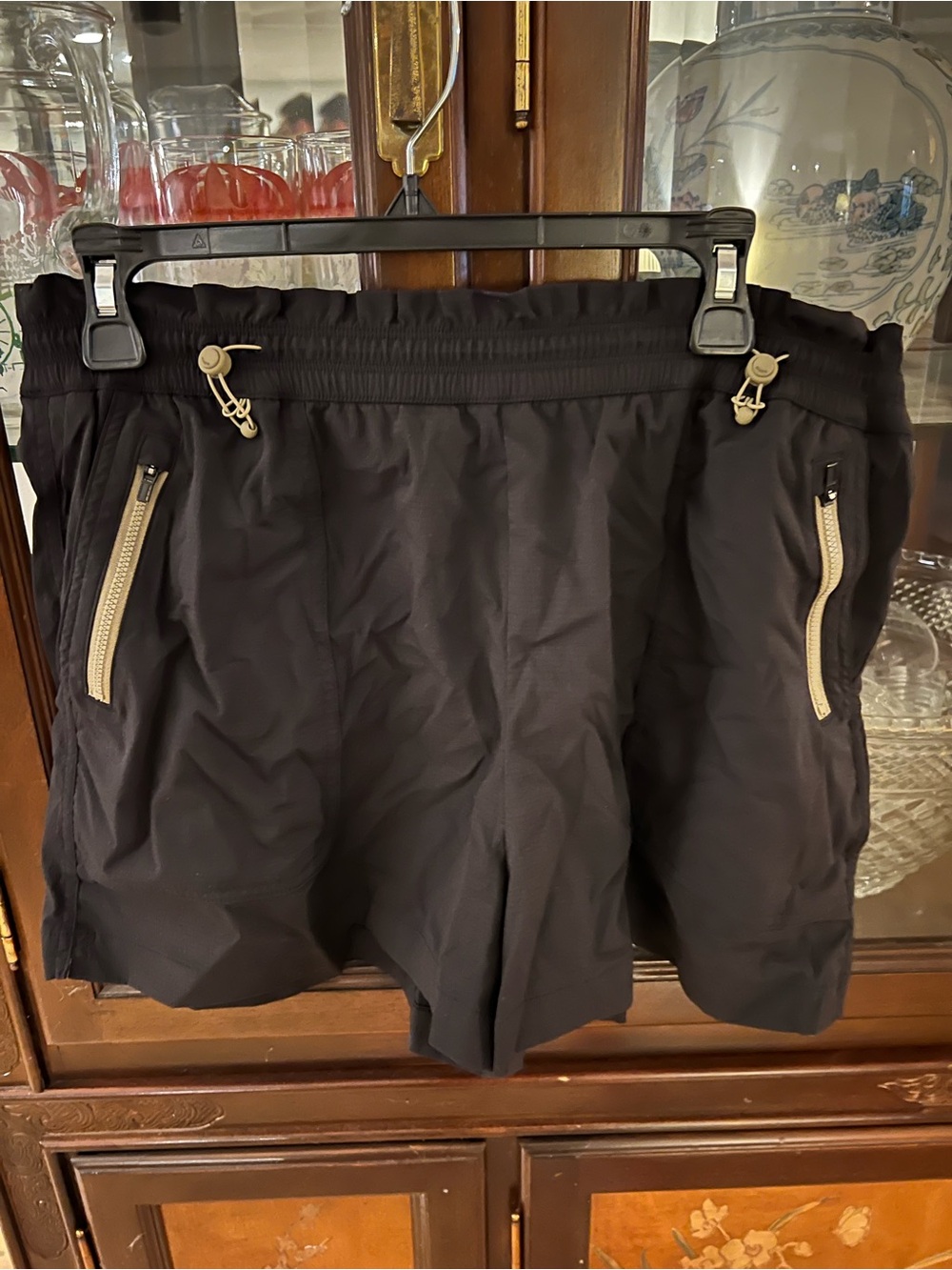 Women’s Athleta Black Athletic Shorts with Tan Trim size L